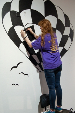 thirty-two students worked in collaborative groups and created large-scale drawings in black tape