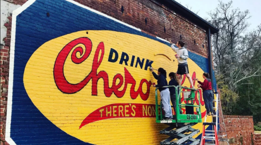 UGA students restore a vintage Chero-Cola sign at Oconee Brewing Company in Greensboro, Georgia.