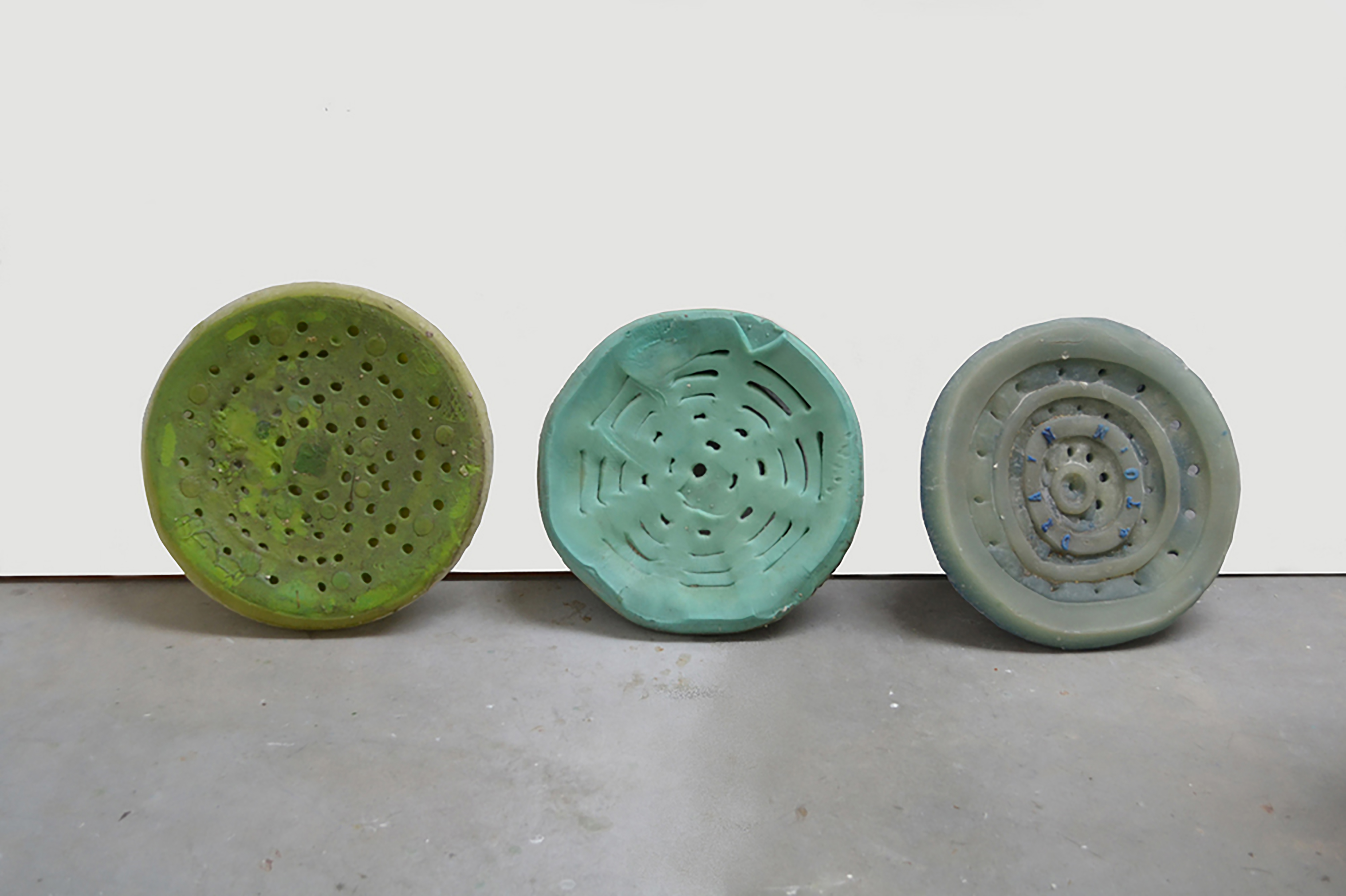 Bonnie Rychlak, "Morphed Florida Drains," 2012-13, hand carved cast wax, approx 4" x 22"