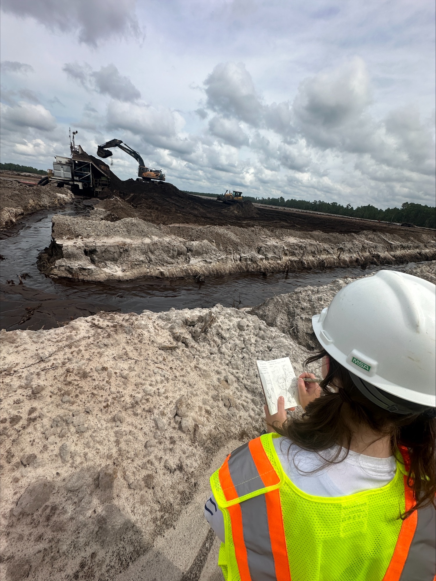 Art in the field student drawing landscape of the Chemours Mission Mine during a visit in September 2024