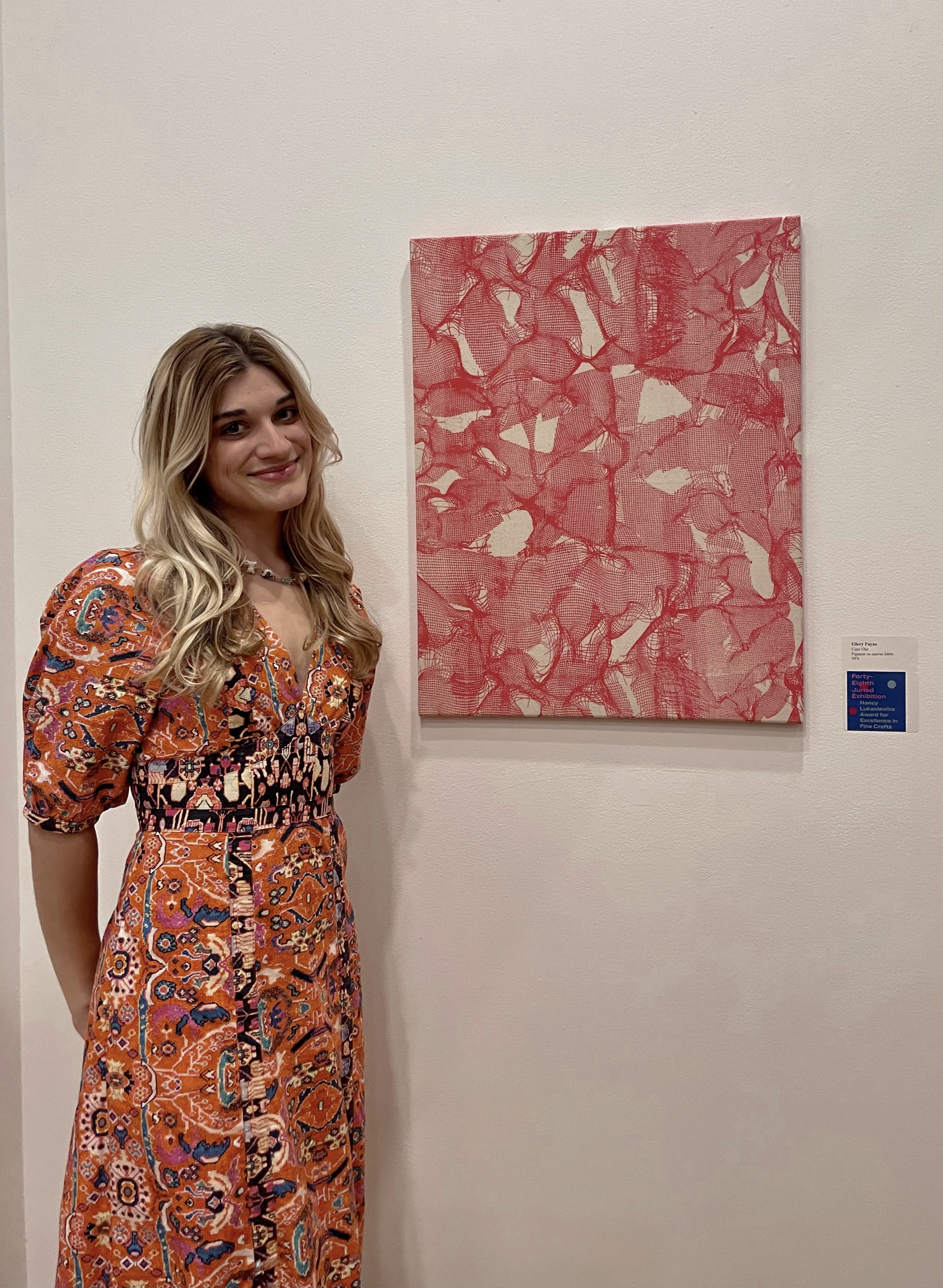 Ellery Payne with Cast Out (2022) at Lyndon House Art Center 48th Juried Exhibition Opening, March 2, 2023. Courtesy of Ellery Payne.