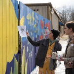 Photo: Student Volunteers dicussing exterior mural design