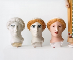 Researchers demonstrate the process of applying color to the Treu Head, from a Roman sculpture of a goddess, made in the second century A.D. Ancient sculptures were often painted with vibrant hair colors and skin tones.  Photograph by Mark Peckmezian for The New Yorker