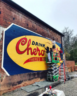 UGA students restore a vintage Chero-Cola sign at Oconee Brewing Company in Greensboro, Georgia.