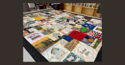 The completed quilt from the Linnentown Quilt Project lays on a table on April 10, 2022 at the Georgia Museum of Art in Athens, Georgia. The quilt features 86 squares and various materials. (Photo/Maddy Franklin)