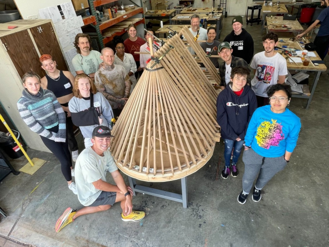 WORK IN PROGRESS. Model of the Notre-Dame de Paris roof framework, 1:10 scale, white oak, pictured here with Handshouse Studio: Notre-Dame Project workshop participants at the University of Georgia, Lamar Dodd School of Art in Athens, GA, Fall 2022.
