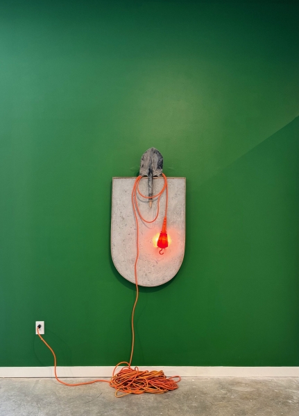 Krista Clark (American, b. 1975), How to Water a Garden, 2024, walnut frame, concrete, shovel, work light, dimensions variable, courtesy and copyright the artist, photo: Stove Works, Chattanooga, TN.