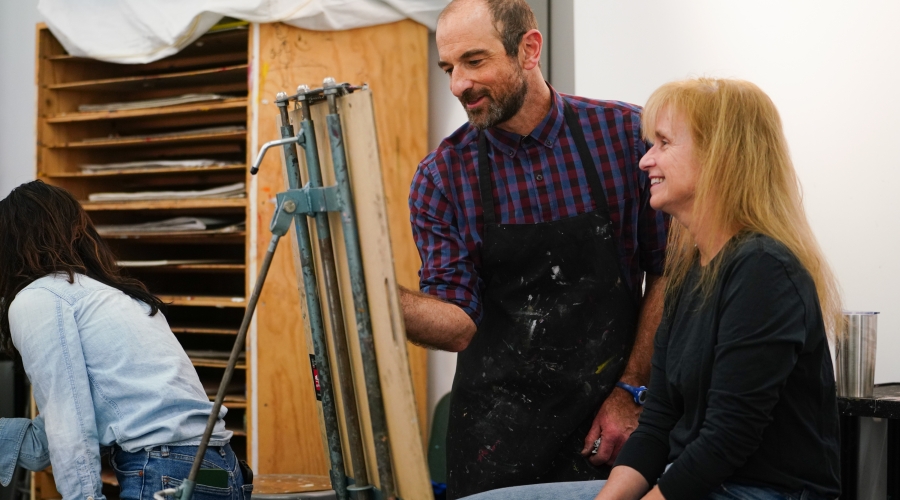 Associate Professor Ben Britton with student in spring 2025 UGA Community Art School class. Photograph courtesy of Sidney Chansamone.