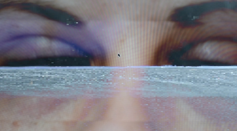 An image of two eyes with a line of static going through the eyes