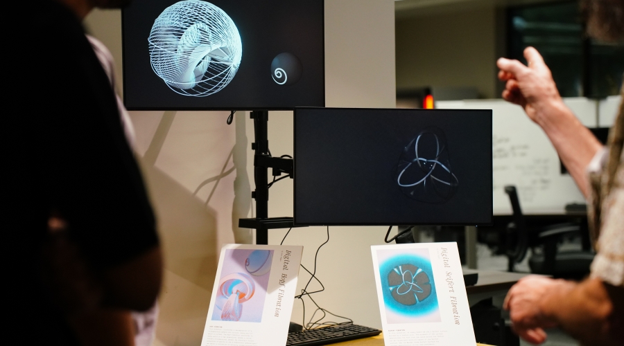 Professor Dave Gay explains digital animations of topological objects at the opening of Spacing Out, November 6, 2024. Photo courtesy of Sidney Chansamone.