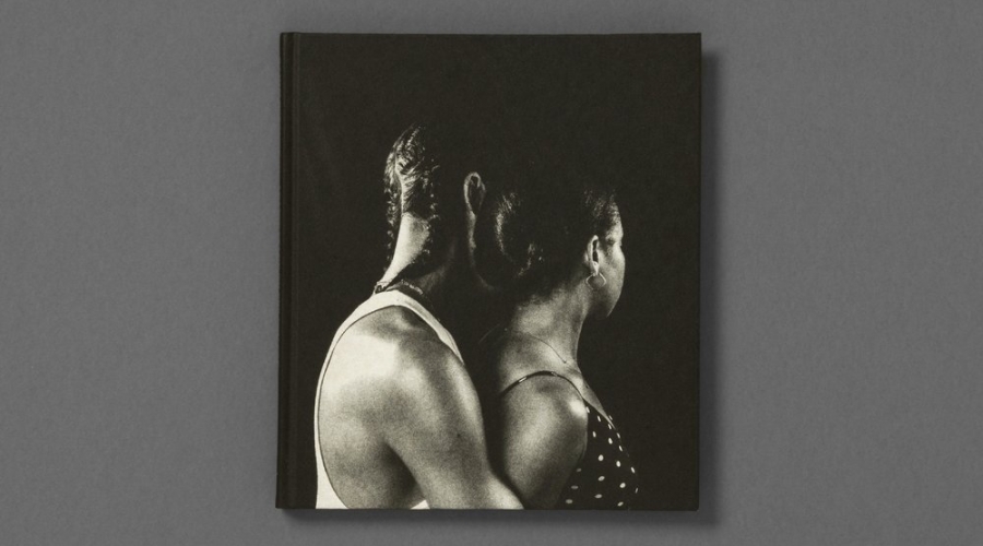 Cover image of I Can't Stand to See You Cry, photobook by Rahim Fortune, 2021. Black and white image of a person with braids and tank top holding a person from behind with earrings, necklace, and black and white polka-dot top.