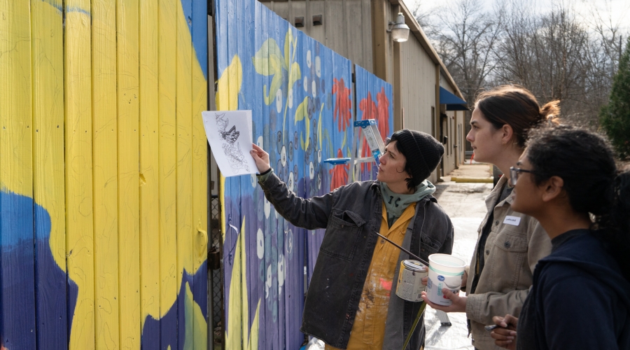 Photo: Student Volunteers dicussing exterior mural design