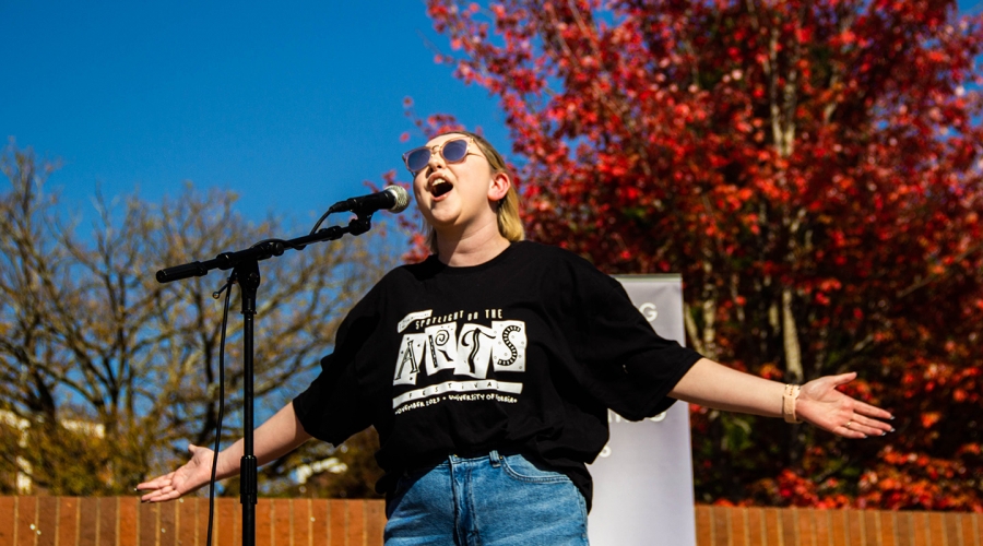 Spotlight on the Arts Student Spotlight participant wearing the 2023 winning design by Megan Montgomery, advertising student in the Grady College of Journalism and Mass Communication. Image courtesy of the UGA Provost's Office.