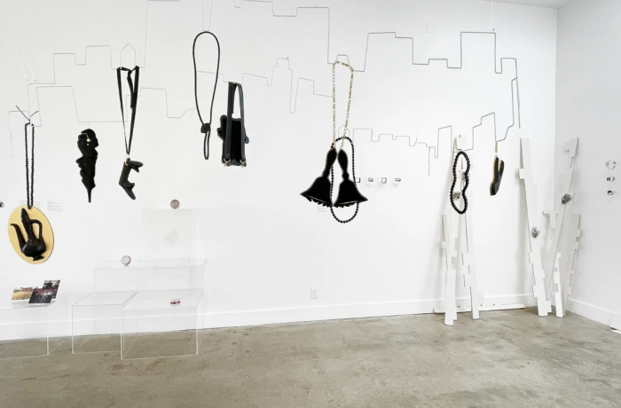 Image of artworks suspended inside gallery space.