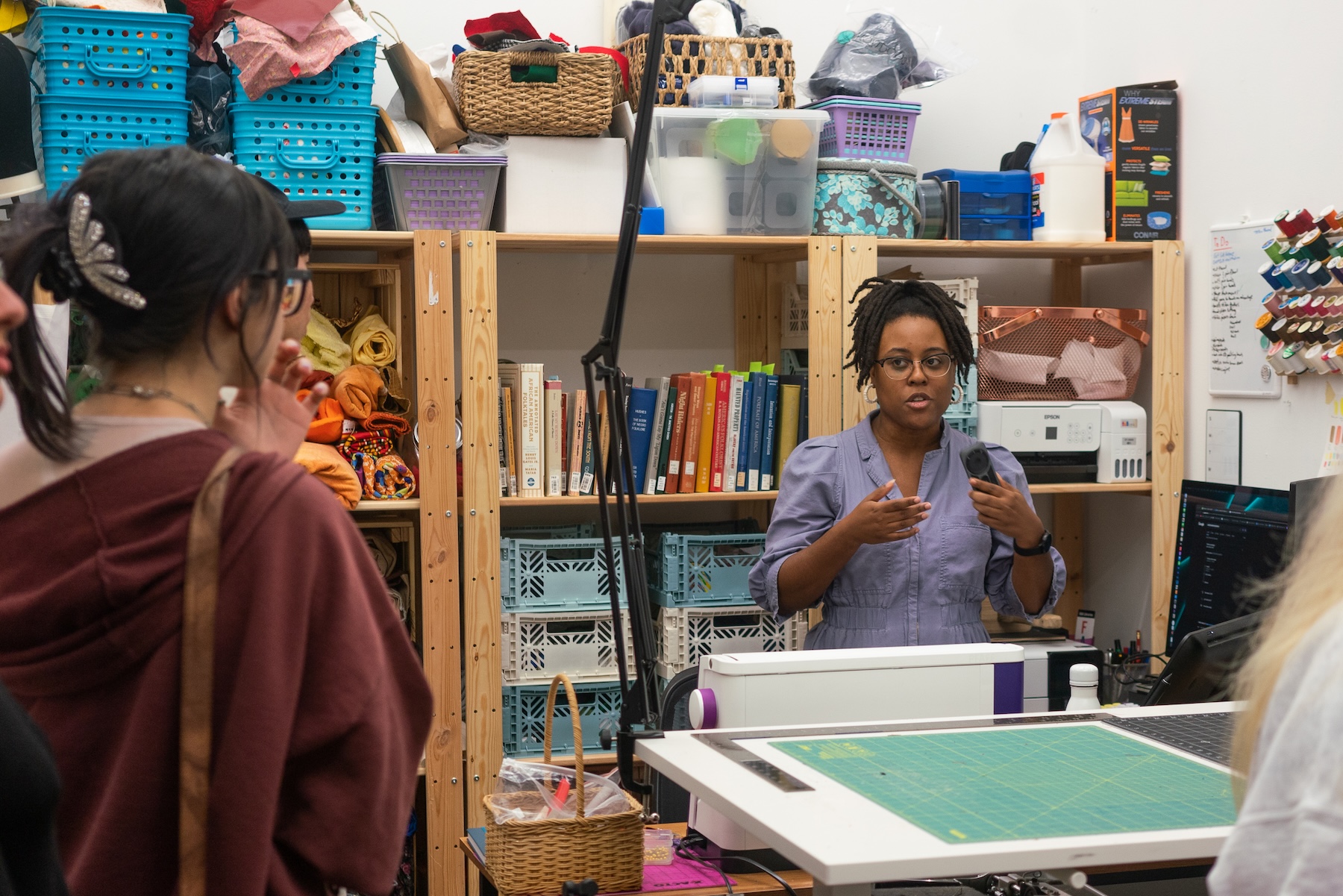 First-year MFA student Jasmine Best speaks to guests in her studio space in the Lamar Dodd School of Art during the Art Party Extravaganza on September 16, 2022. 