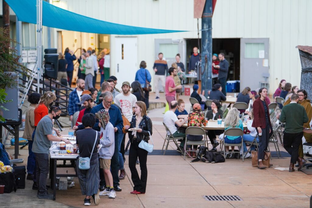 Students, faculty, and members of the community gathering at Thomas Street Art Complex for the Short Shorts Film Festival and Open Studios on September 29, 2022. 