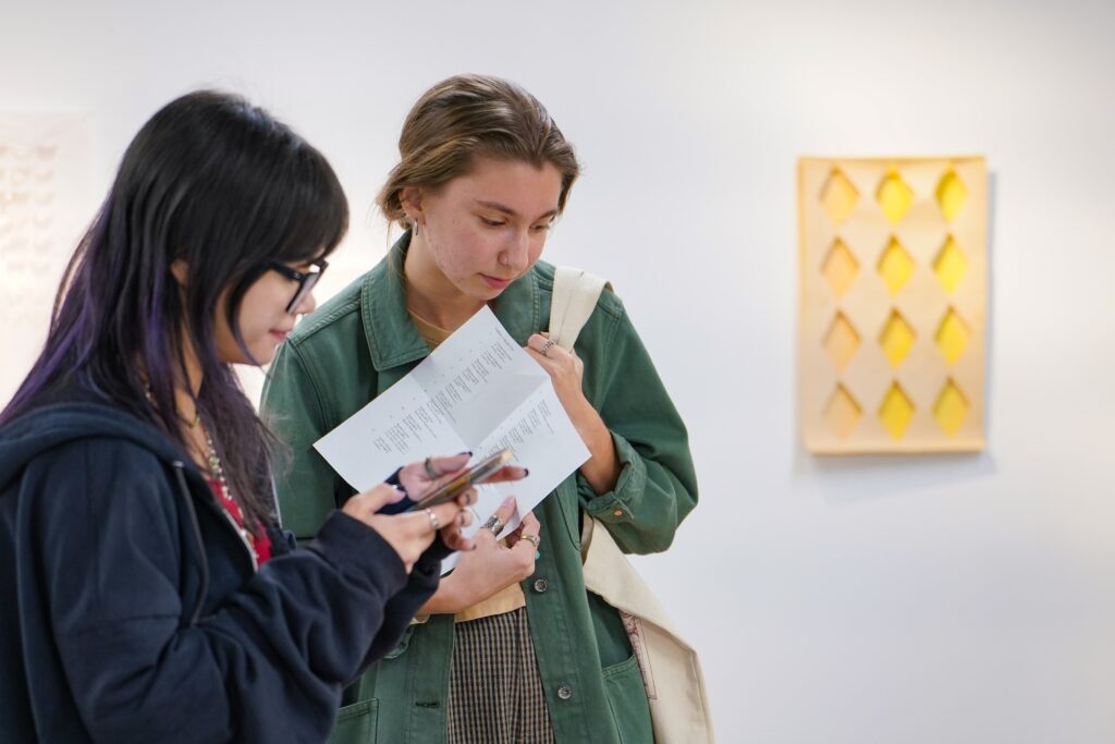 Visitors viewing artwork on display at Thomas Street Art Complex. 