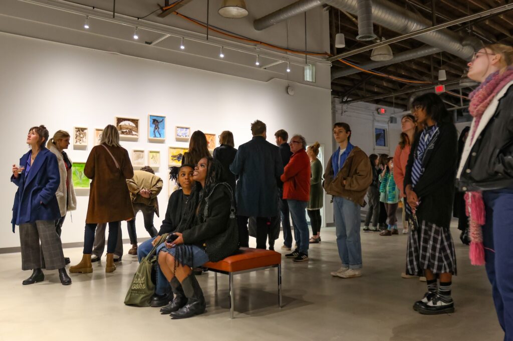 Visitors at the Athenaeum gallery viewing work in Kara Walker: Back of Hand during the opening reception for the exhibition on January 13, 2023.