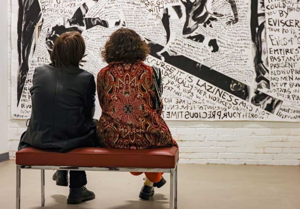 Visitors at the Athenaeum gallery viewing work in Kara Walker: Back of Hand during the opening reception for the exhibition on January 13, 2023.