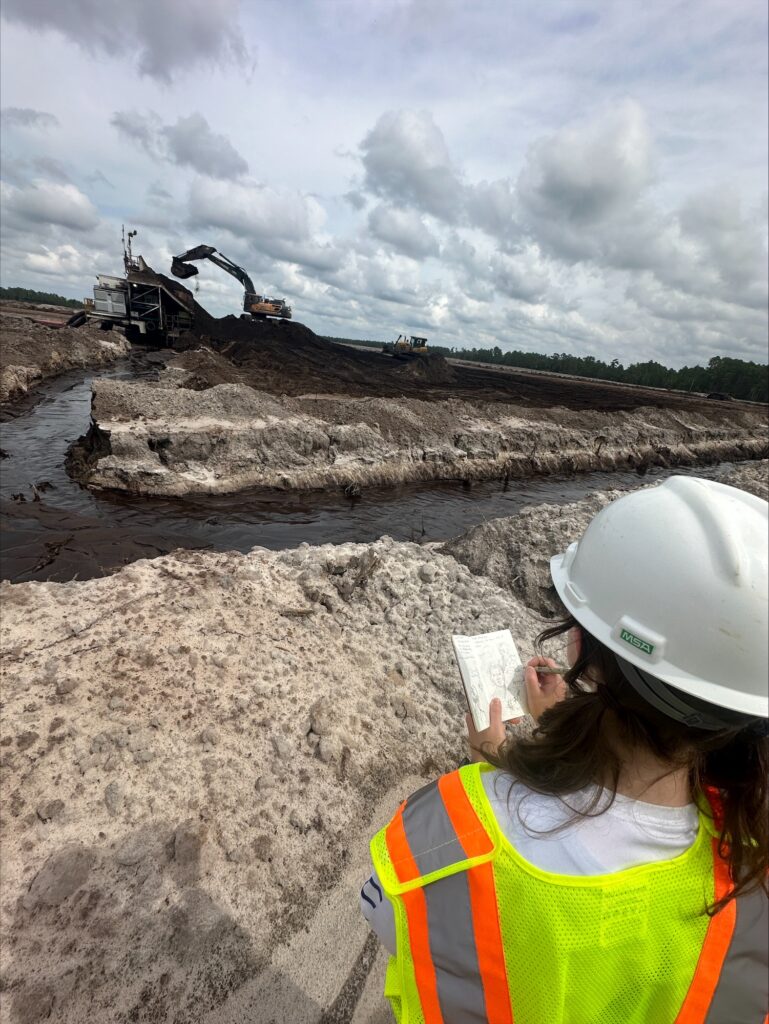 Art in the Field student drawing landscape of the Chemours Mission Mine during a visit in September 2024