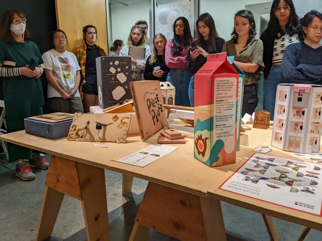 Associate Professor of Graphic Design Moon Jang leads a presentation of student work in the C-U-B-E Gallery exhibition Design for a Museum: Tangible & Functional Objects III for the fall 2022 course ARGD 4060: Design Center