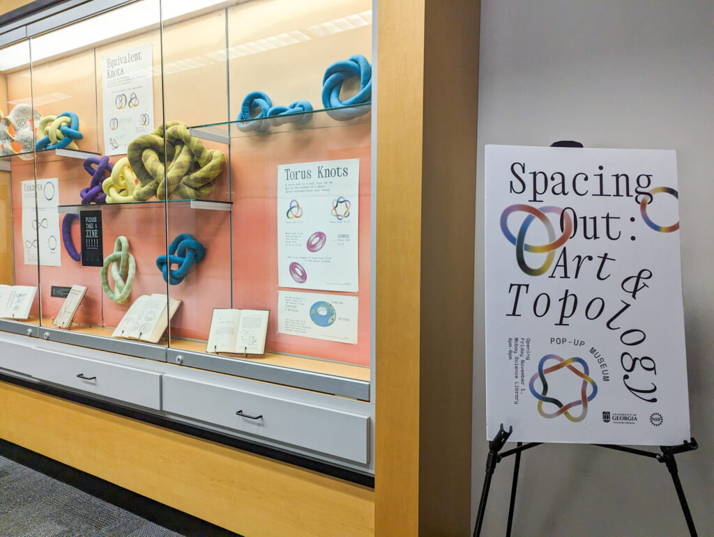 View of Spacing Out: Art and Topology Pop-up Museum at the UGA McBay Science Library, November 2024.