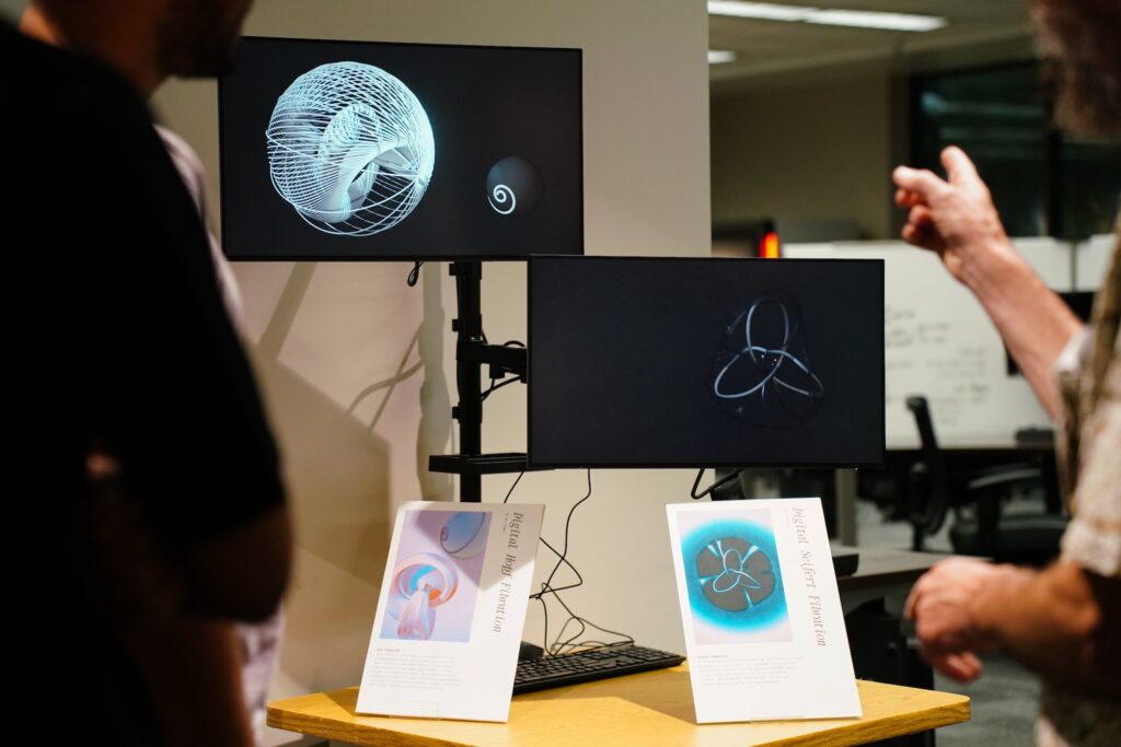 Professor Dave Gay explains digital animations of topological objects by Alex Tepper at the opening of Spacing Out, November 6, 2024. 