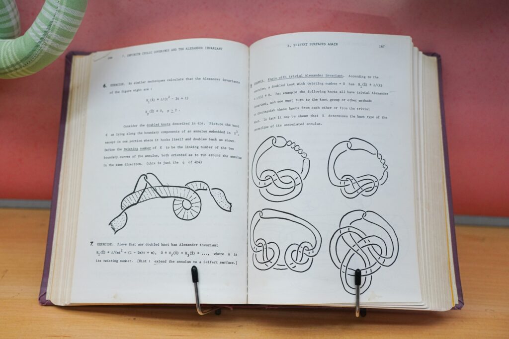 Topology text and diagrams on display in Spacing Out at the UGA McBay Science Library.
