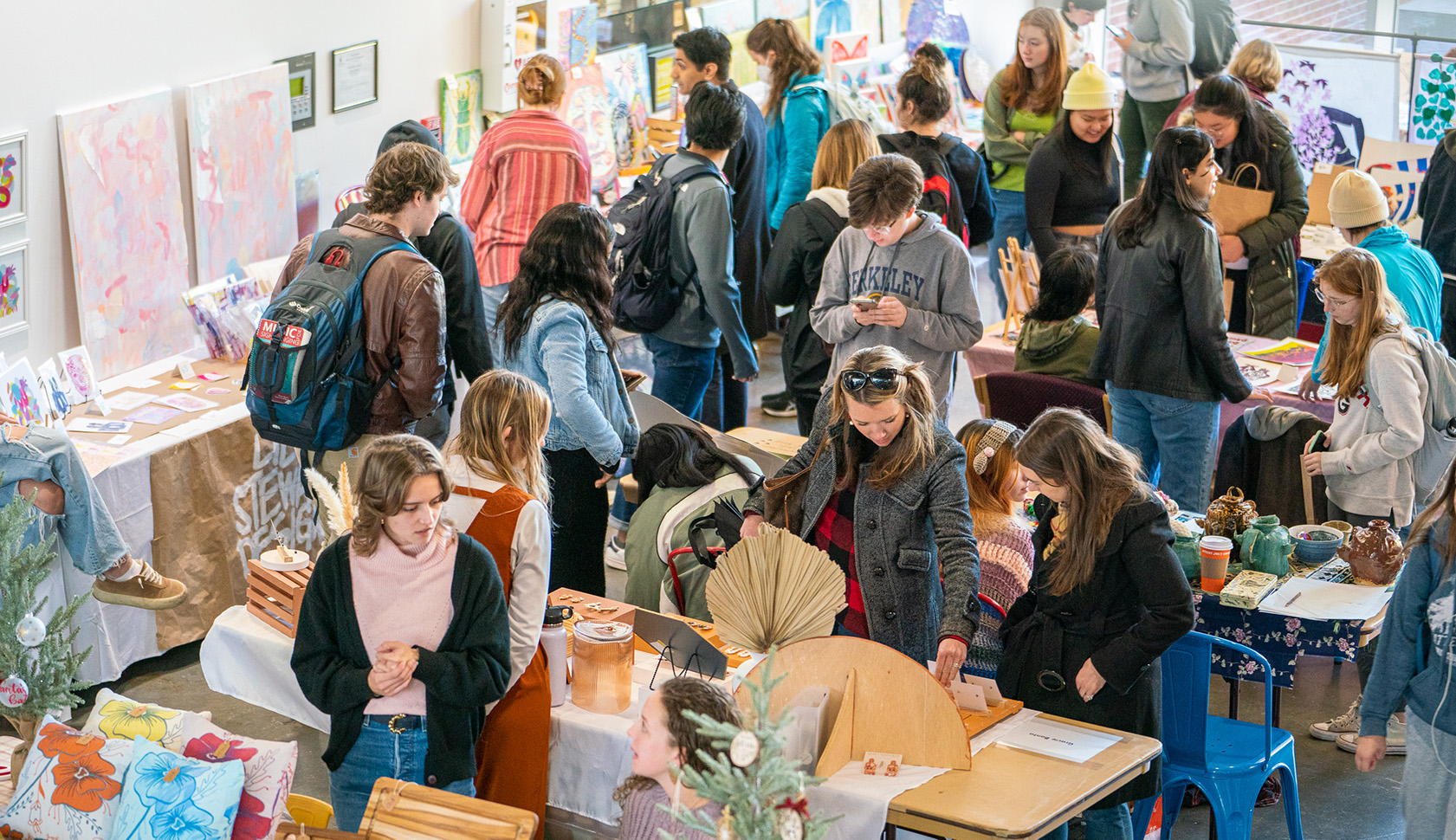 Visitors peruse artwork by 95 student artists for sale on Nov. 18 at the Lamar Dodd School of Art’s 2nd annual Dodd Market. Organized by the Dodd Ambassadors as part of Spotlight on the Arts, the market offers student artists a platform to practice pricing their work and marketing and engaging buyers.