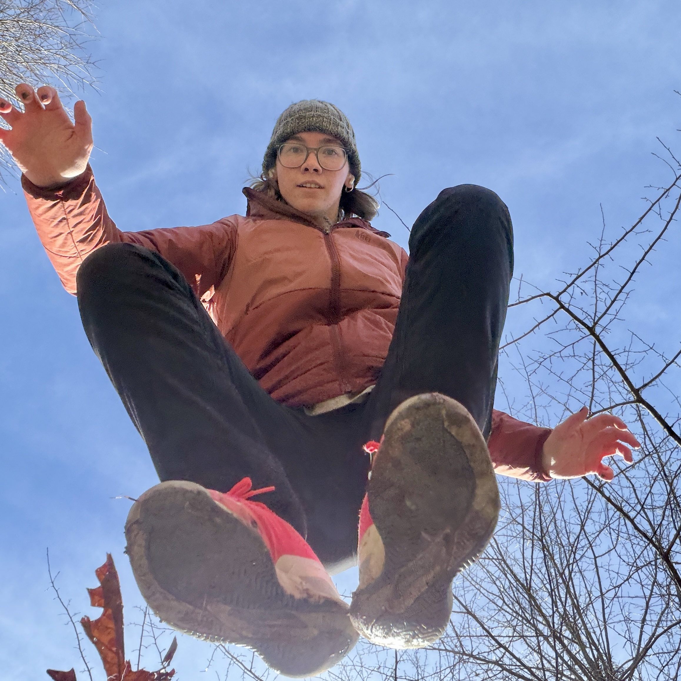 Photo of Clara-Beth mid-jump outdoors