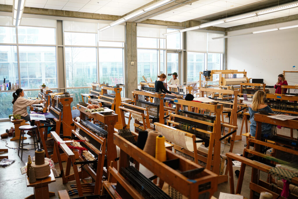 Photo of the weaving studio filled with looms